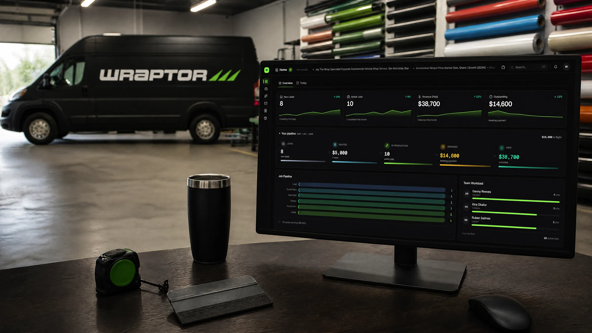 A wrap shop owner's dashboard on screen, the wrapped Wraptor van on the shop floor behind it